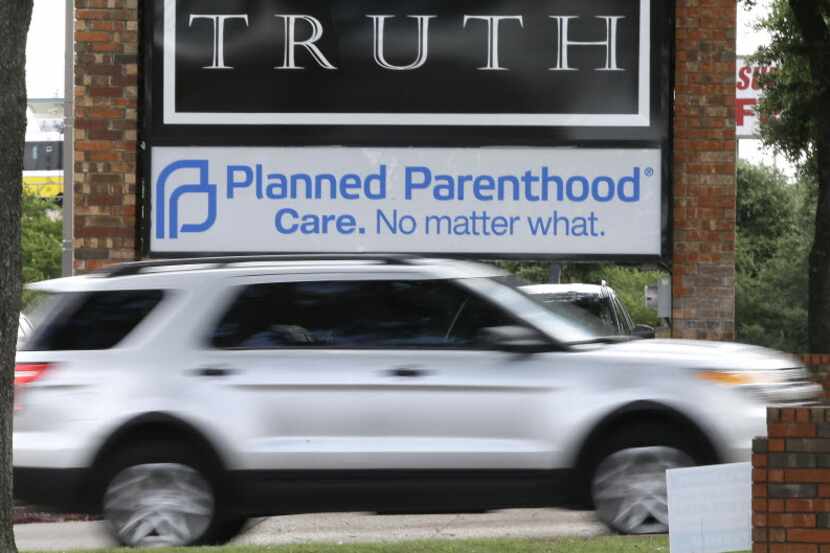 FILE - In a Monday, June 27, 2016 file photo, traffic passes a Planned Parenthood sign in...