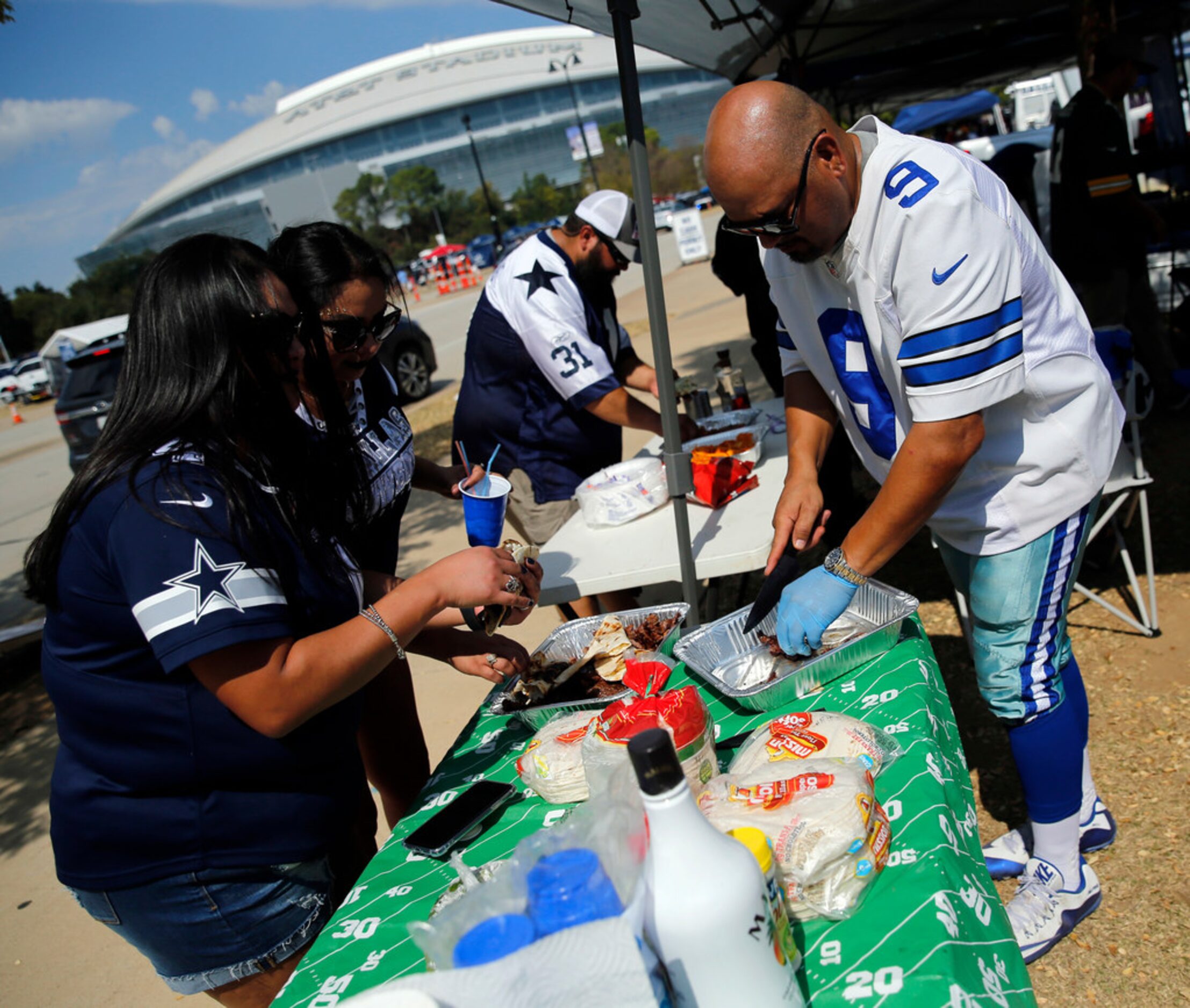 Dallas Cowboys fan Albert Sorola of Grand Prairie, Texas wore former quarterback Tony Romo's...