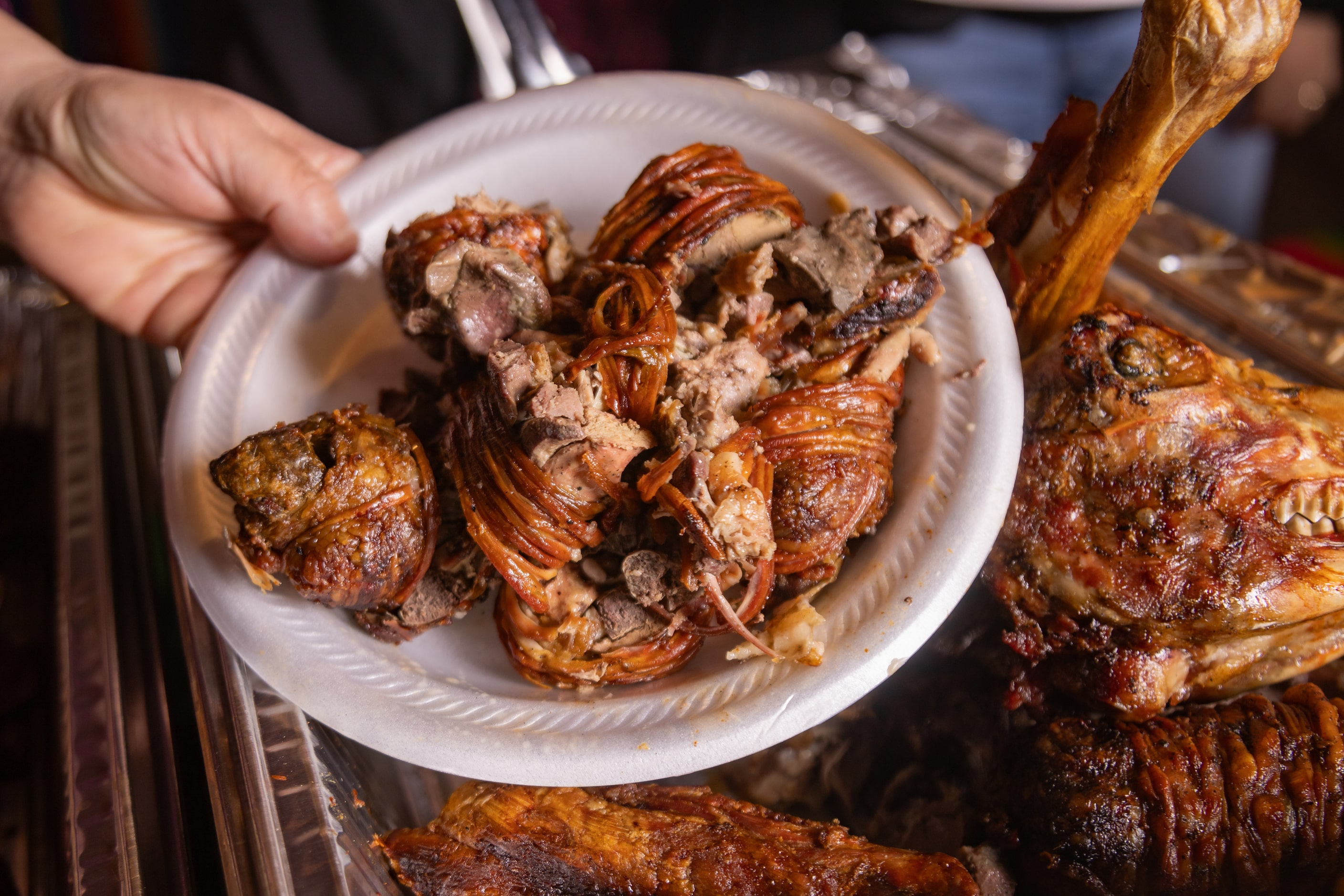 Guests assembled plates featuring cabrito for carne asada , prepared by Montemayor.