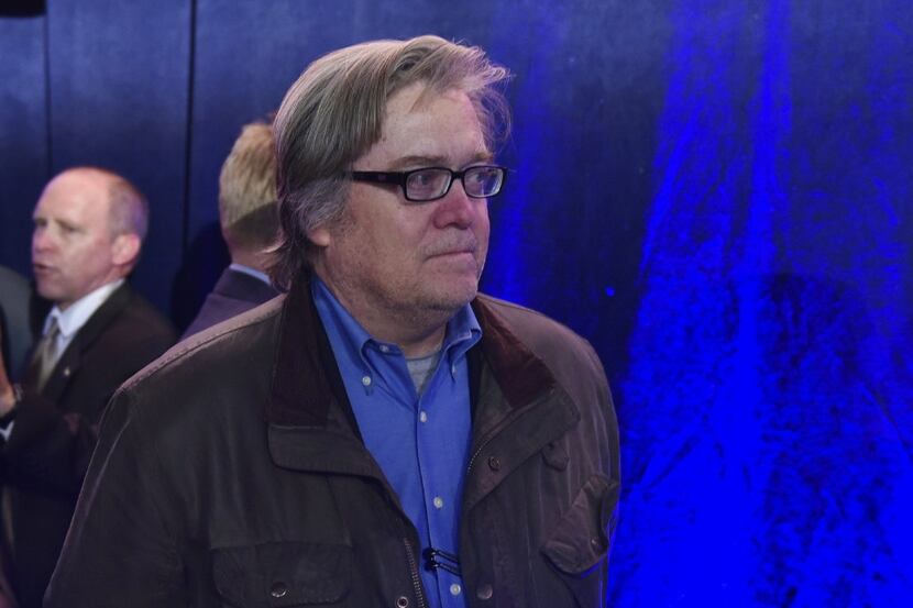 Steve Bannon watches as Republican presidential nominee Donald Trump speaks during a rally...