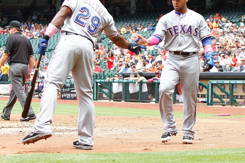 HOUSTON - MAY 12:  Adrian Beltre #29 of the Texas Rangers congratulates Leury Garcia #3 of...