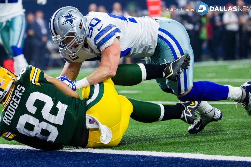 Dallas Cowboys outside linebacker Sean Lee (50) tackles Green Bay Packers tight end Richard...