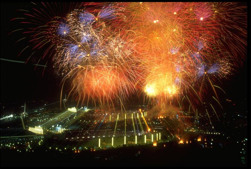 Fireworks exploded high above Barcelona's Olympic Stadium during the opening ceremony of the...