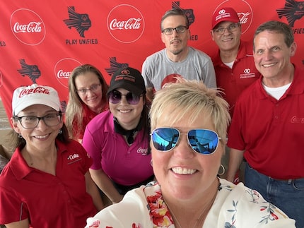 Special Olympics Texas athletes pose for a selfie with CCSWB staff in the Champions Lounge