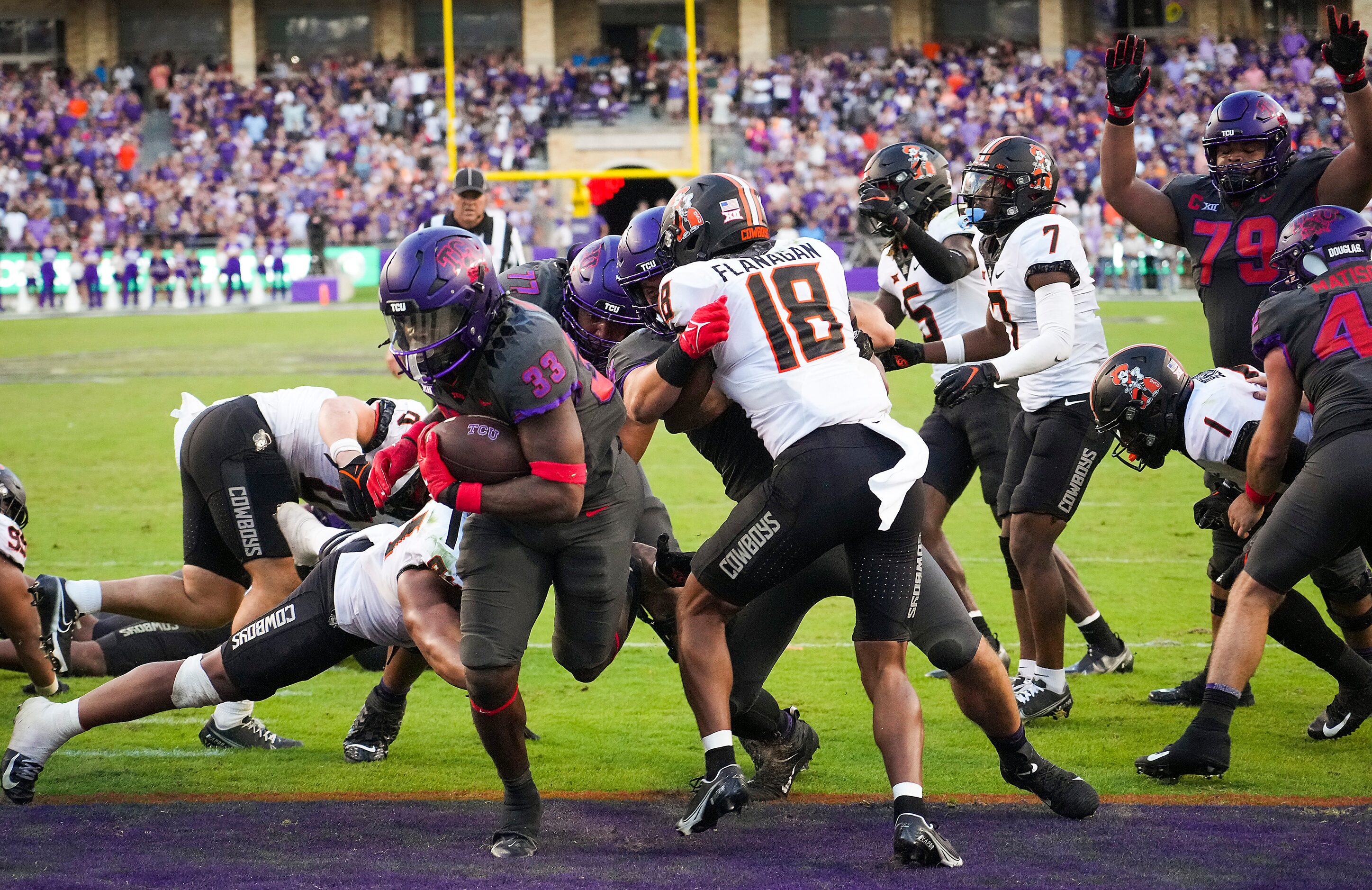 TCU running back Kendre Miller (33) scores on a game-winning 2-yard touchdown run to give...