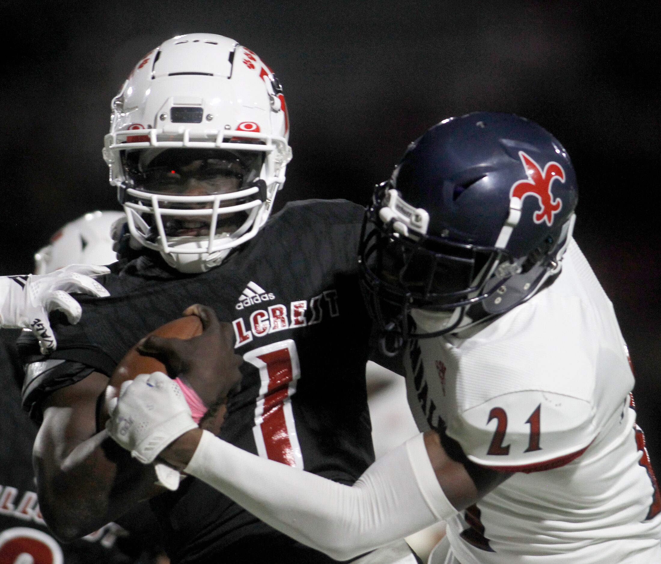 Dallas Hillcrest quarterback Carter Sido (1) is tackled in the red zone by Dallas Kimball...