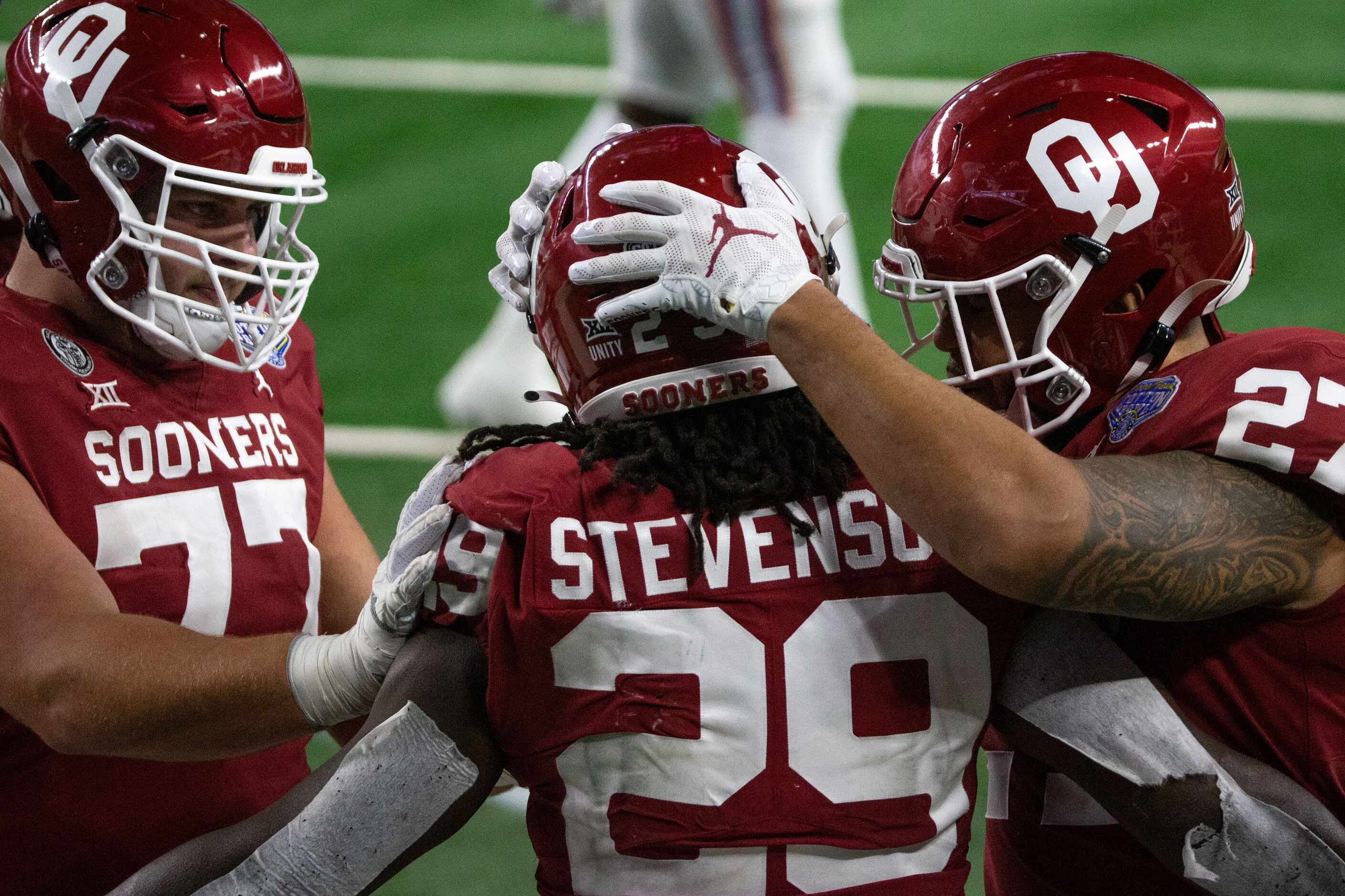 Oklahoma Sooners running back Rhamondre Stevenson (29) celebrates with Oklahoma Sooners...