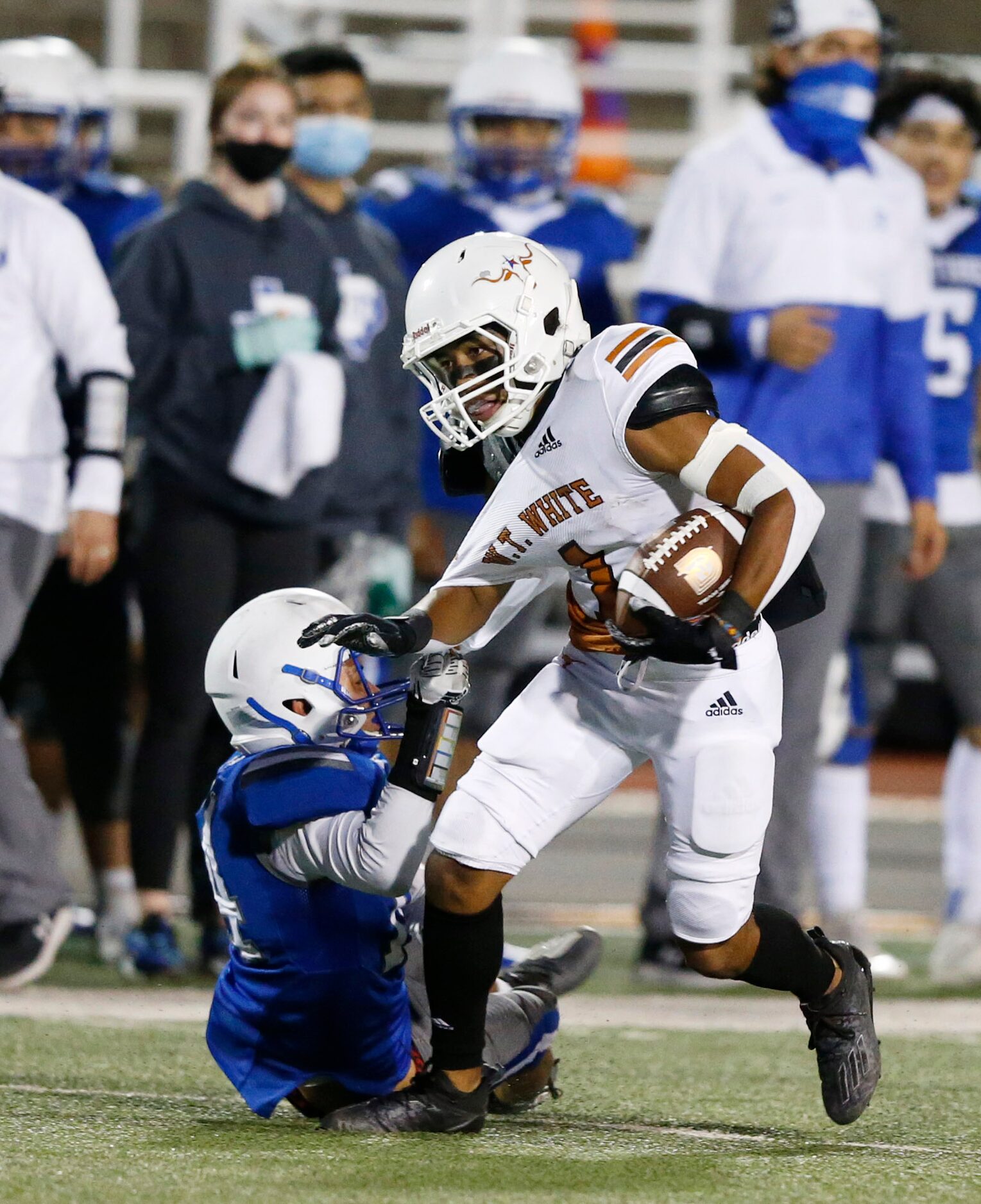 W.T. White's Dominik Dozal (1) attempts to break away from Carrollton R.L. Turner's Dylan...