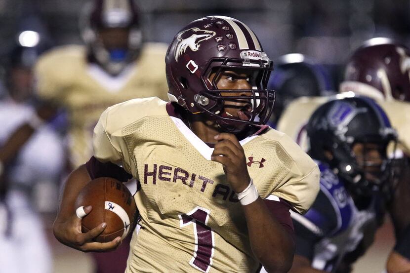 Heritage quarterback Amare Jones (1) looks for room to run in the first quarter as Frisco...