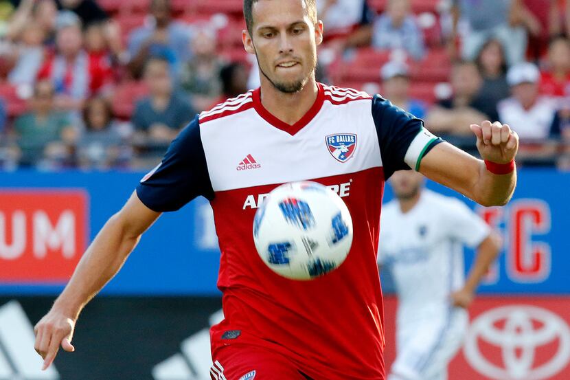 FC Dallas defender Matt Hedges (24) controls the soccer ball during the first half as FC...