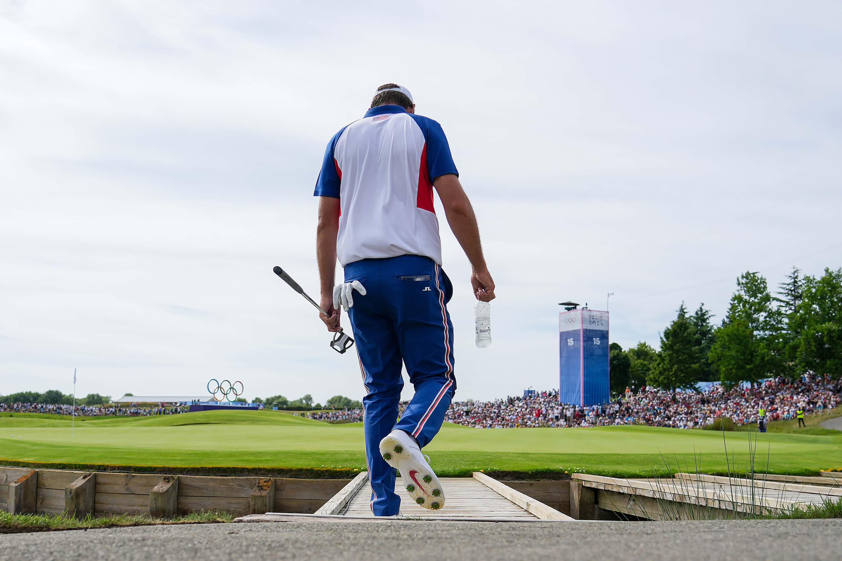Scottie Scheffler of the United States walks to the 18th green during the final round of...