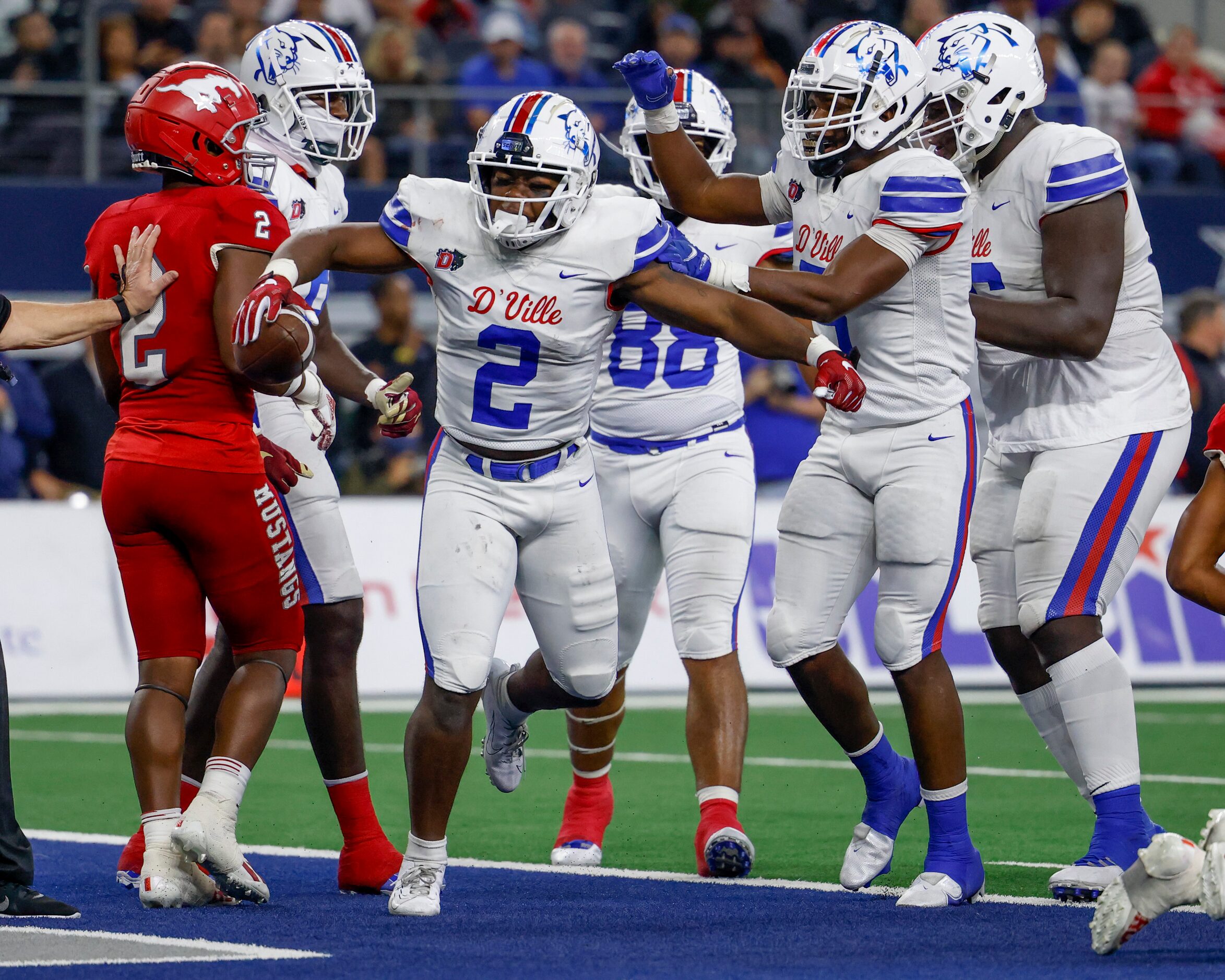 Duncanville linebacker Jordan Crook (2) celebrates his rushing touchdown with Duncanville...