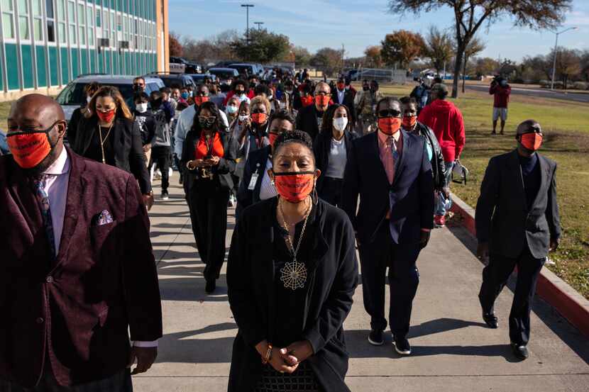 Principal Sharron Jackson marches with Dallas ISD faculty and students outside of Oliver W....