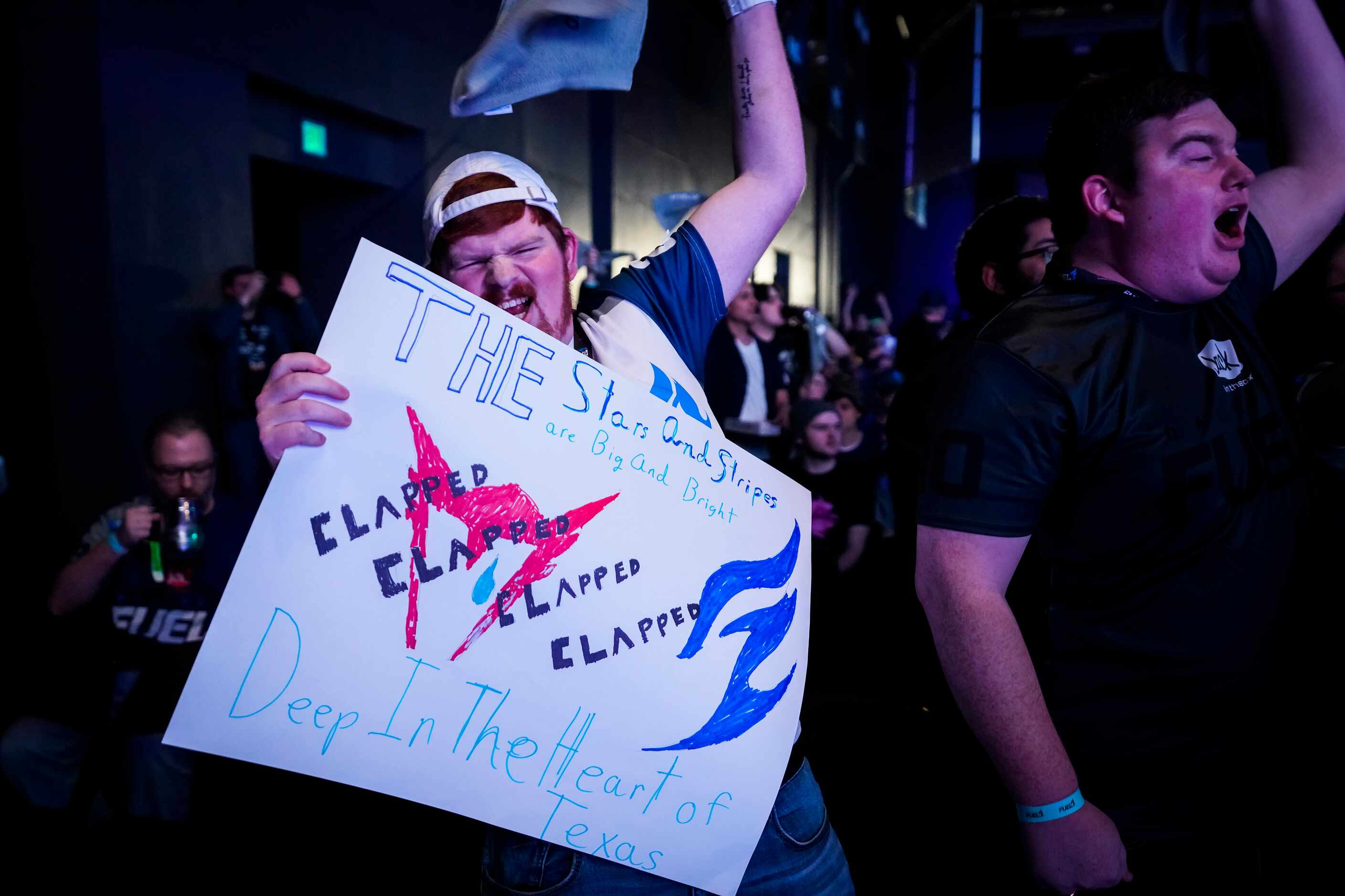 Dallas Fuel fans cheer their team before the start of a Overwatch League match against the...
