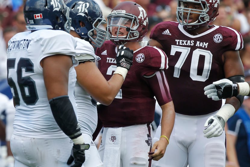 Texas A&M Aggies quarterback Johnny Manziel (2) gets in the face of Rice Owls defensive...