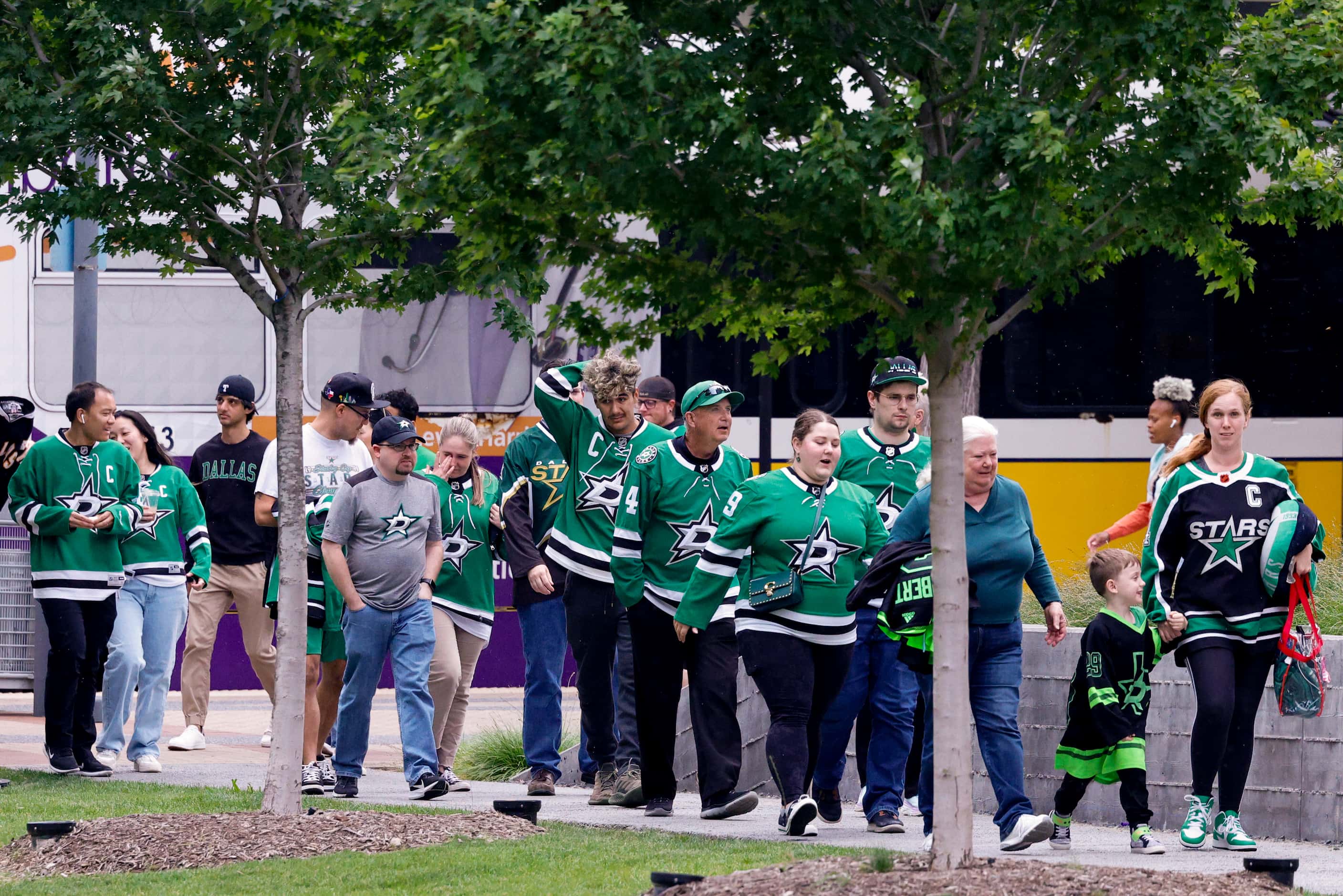 Dallas Stars fans make their way from the Victory DART station before Game 1 of the NHL...