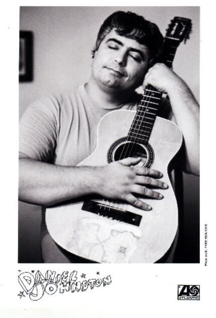 Daniel Johnston poses with his guitar in a promotional material for Atlantic Records.