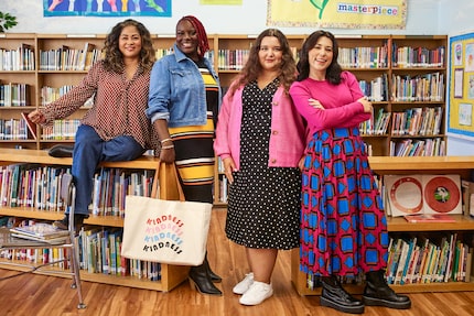 DISD teacher Anna Garza-Garcia is wearing a pink cardigan sweater. She is one of seven...