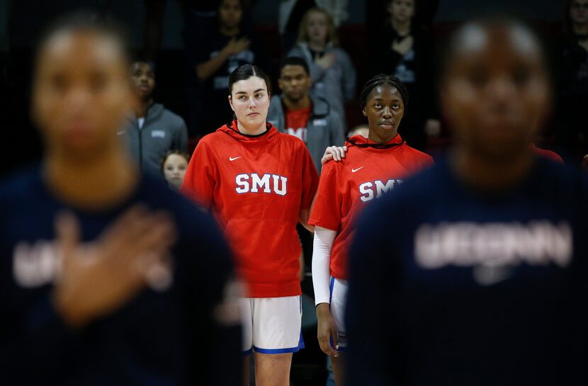 The Southern Methodist Mustangs and UConn Huskies line up for the national anthem prior to a...