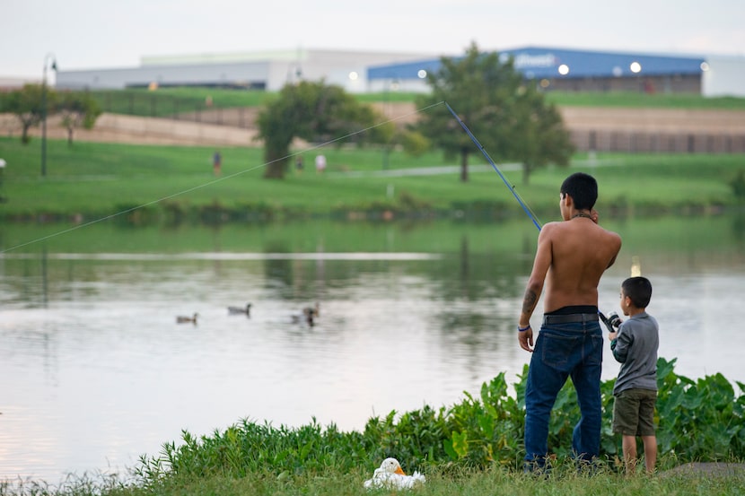 Terrance Hunt gave son Milton Smith Ceren Mejía a fishing lesson at Bachman Lake last...