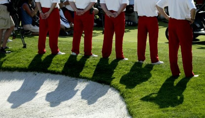 Tournament volunteers clad in the signature red slacks identifying them as Salesmanship Club...