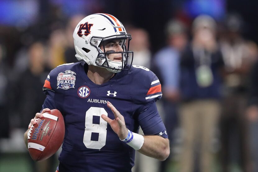 ATLANTA, GA - JANUARY 01:  Jarrett Stidham #8 of the Auburn Tigers looks to pass in the...