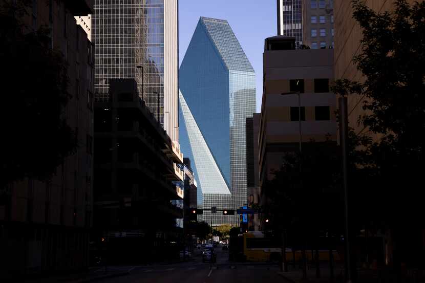 The 60-story Fountain Place (center) towers over the streets of downtown Dallas on Friday,...