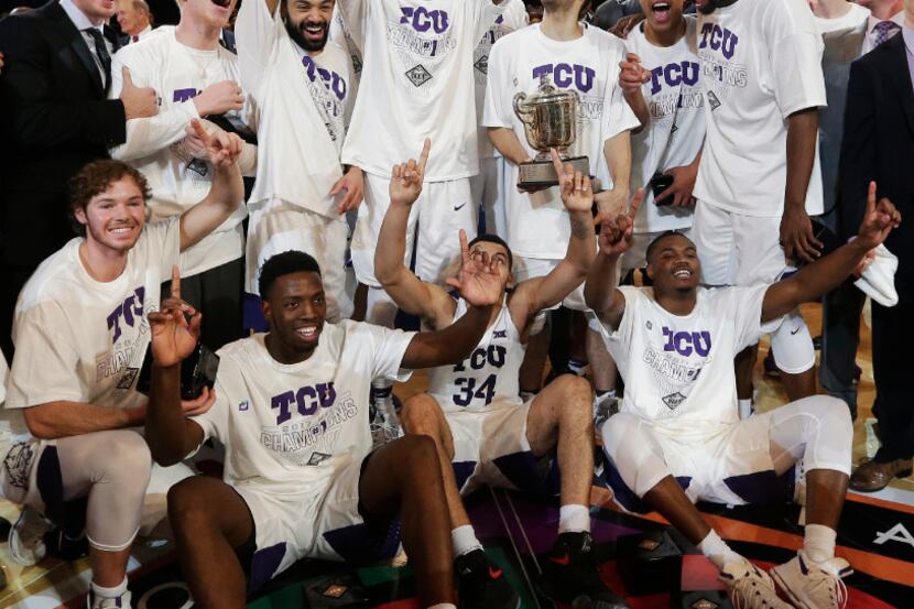 The TCU men's basketball team celebrates after beating Georgia Tech in the NIT final...
