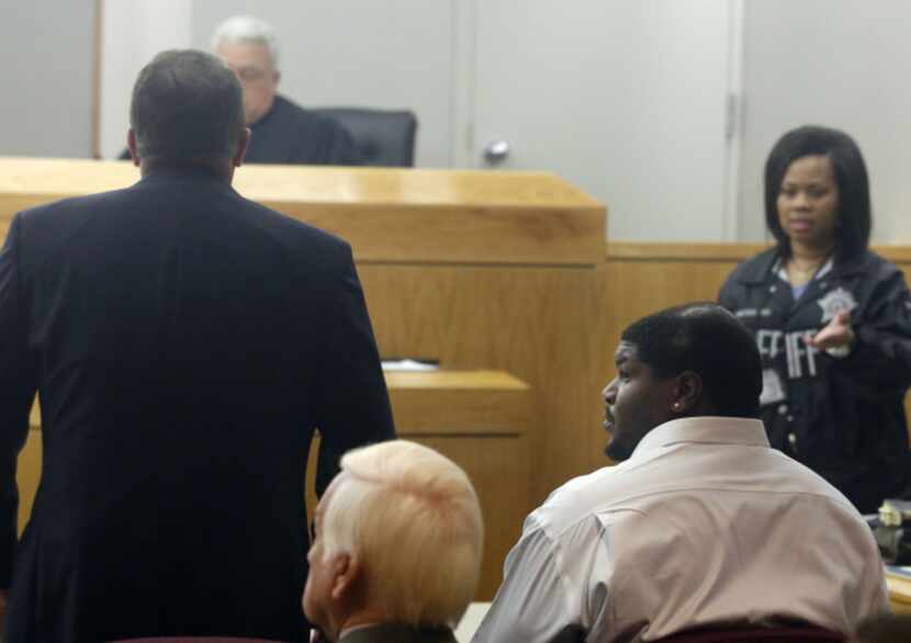 Dallas Cowboys defensive tackle Josh Brent (right) and his attorney George Milner (left)...