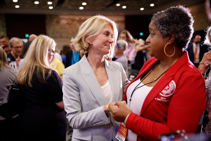 Former Texas State Senator Wendy Davis (left) is greeted by Texas State Representative...