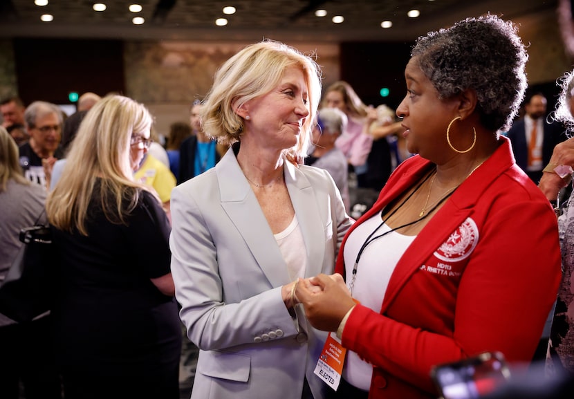 Former Texas State Senator Wendy Davis (left) is greeted by Texas State Representative...