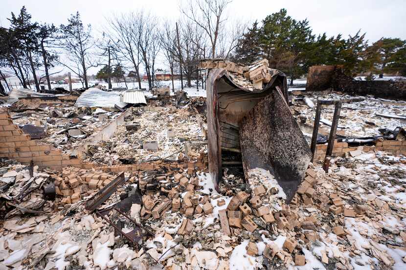 A charred refrigerator is seen at a property destroyed by the Smokehouse Creek Fire, Feb....