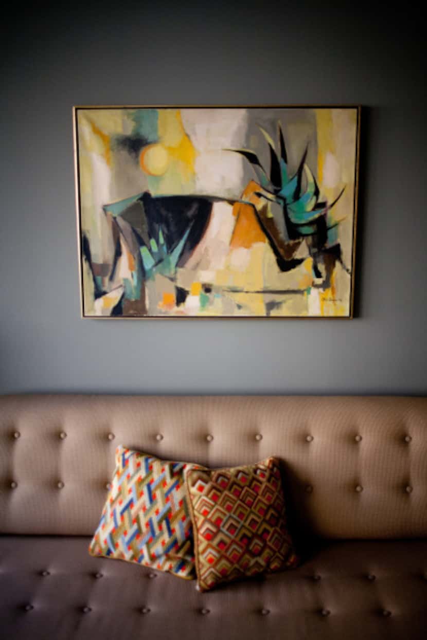 A prized Otis Dozier painting above the living room sofa.