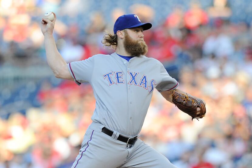 WASHINGTON, DC - JUNE 09: Andrew Cashner #54 of the Texas Rangers pitches in the first...