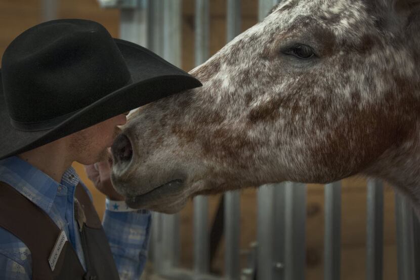 Ryan Wolf of Dallas gives Malibu a kiss at the Equest Ridefest 2015 Festival of Hope at the...