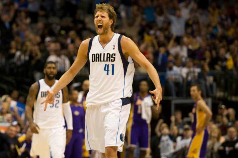 Dirk Nowitzki (41) of the Dallas Mavericks celebrates after a made three-pointer in the 4th...