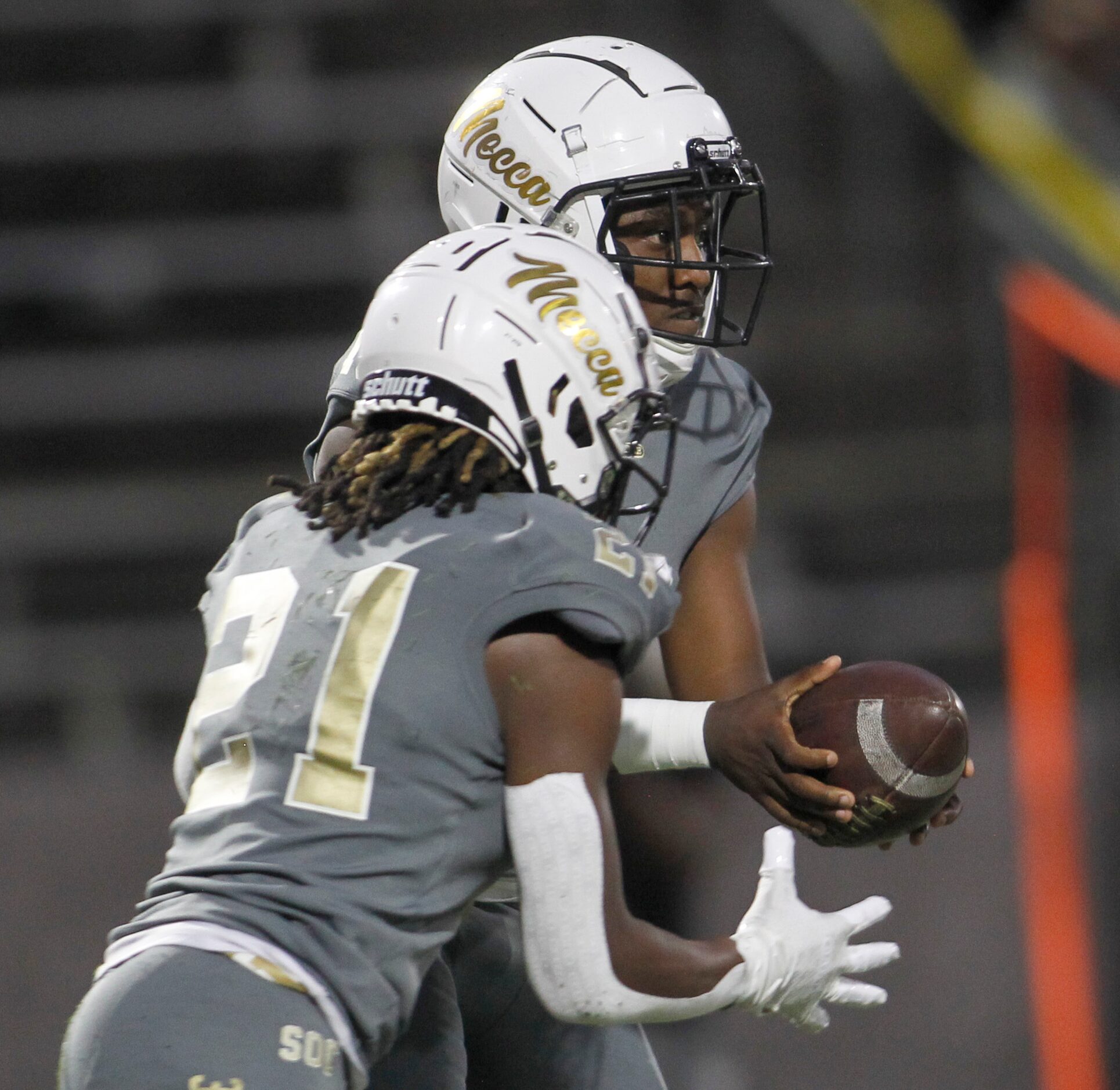 South Oak Cliff running back Danny Green (21) steps up to take the handoff from quarterback...