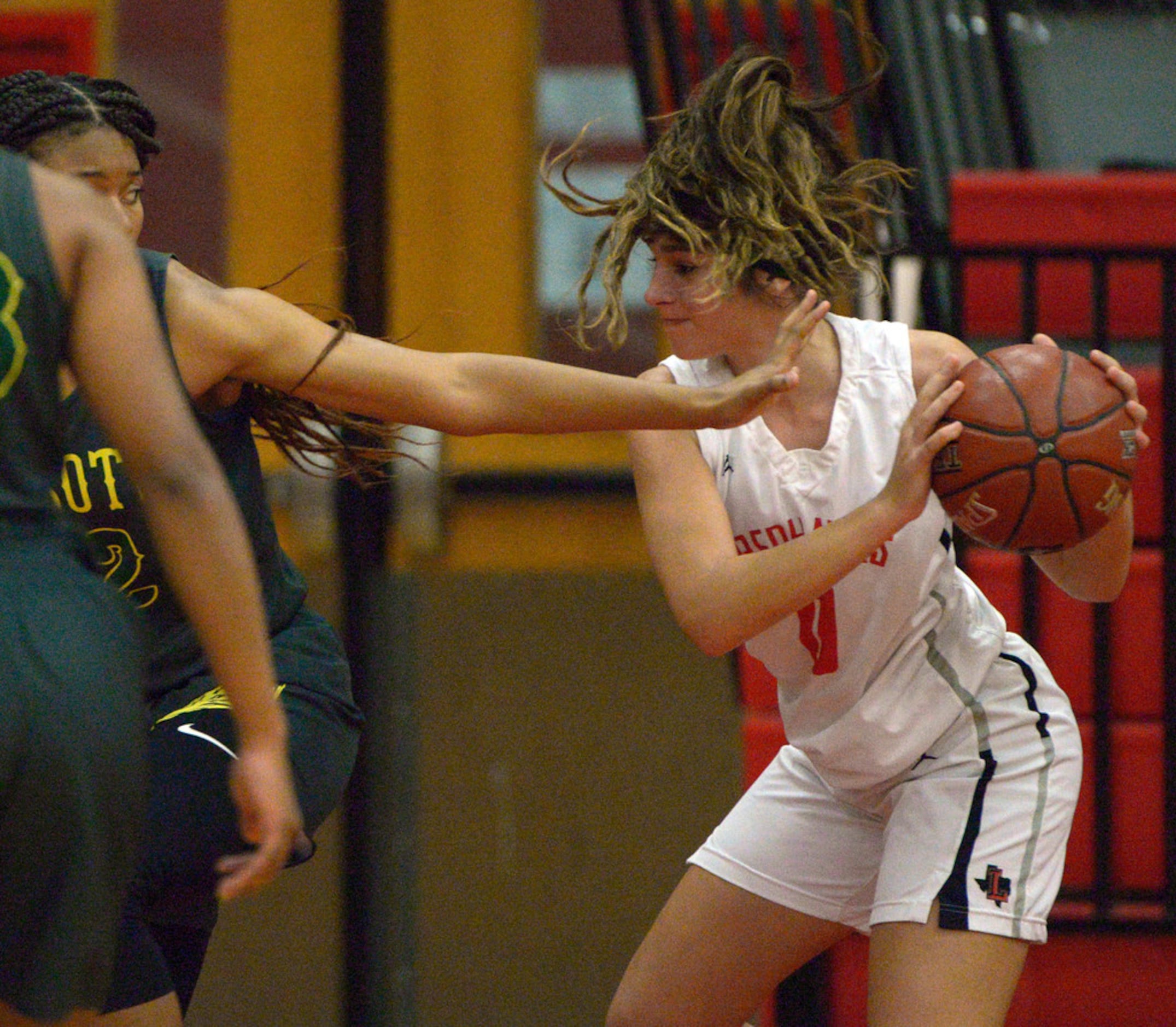 Liberty's Jezelle Jolie Moreno (0) looks for room to pass in the second half during a girls...