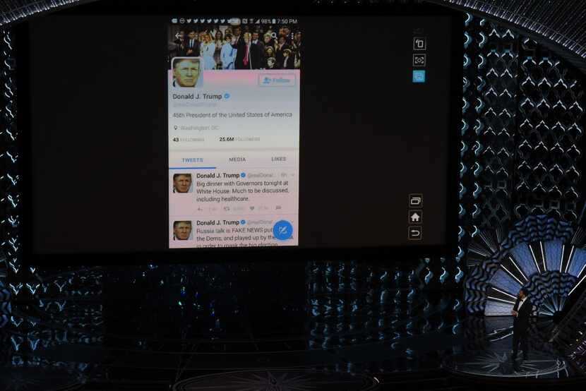 Host Jimmy Kimmel checks President Donald Trump's twitter account on a giant screen at the...