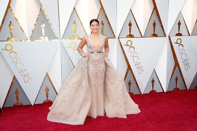 Gina Rodriguez arrives at the 90th Academy Awards wearing Zuhair Mirad Couture.