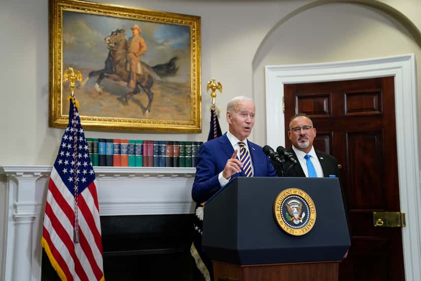 President Joe Biden speaks about student loan debt forgiveness in the Roosevelt Room of the...