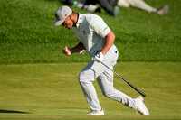Bryson DeChambeau celebrates after a eagle on the 18th hole during the third round of the...