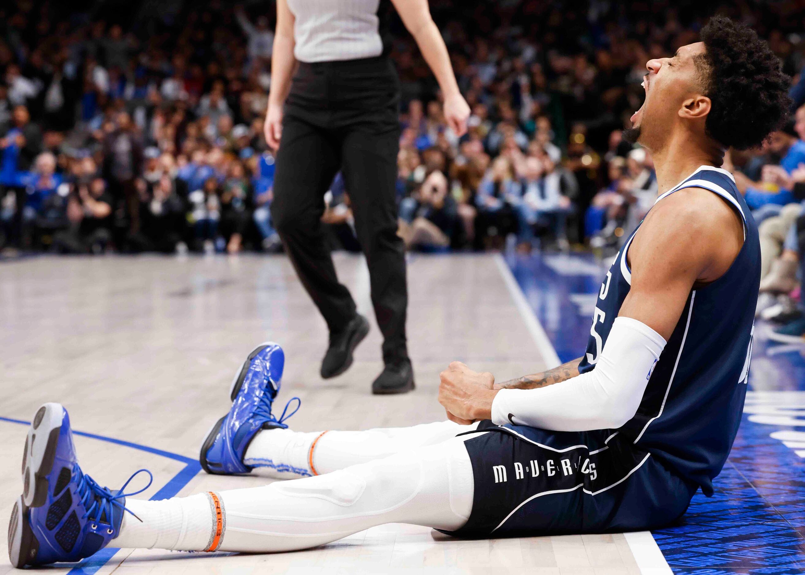 Dallas Mavericks forward Christian Wood (35) reacts after scoring a three-pointer during the...