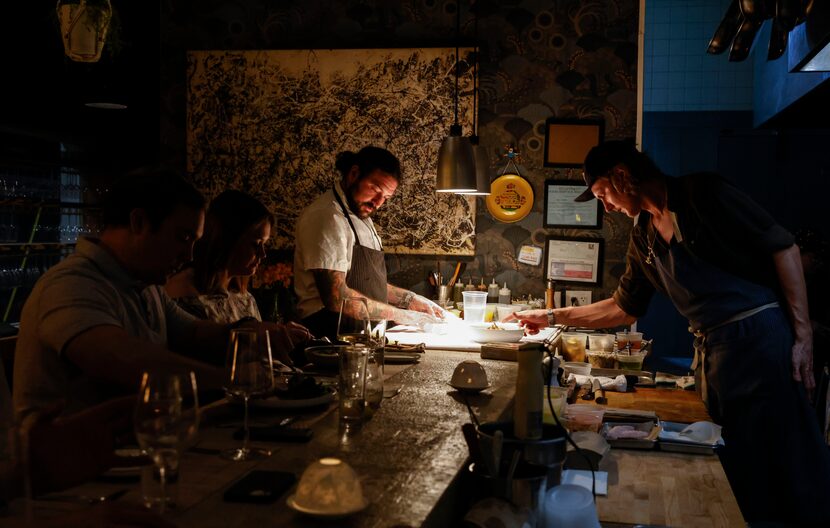 Chef Ross Demers, back left, and chef Liam Byres, right