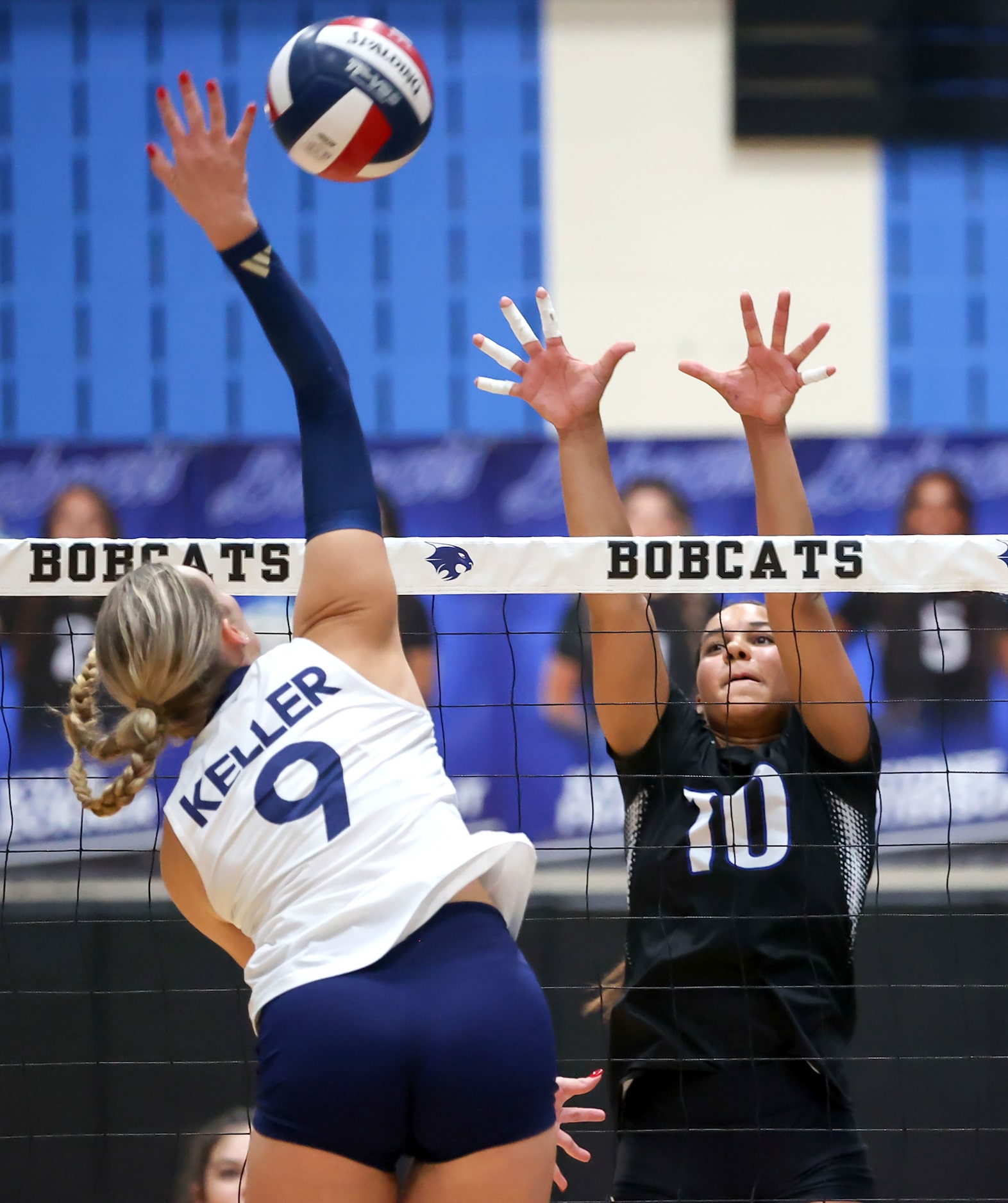 Byron Nelson's Sophee Peterson (10) tries to block a kill from Keller's Lilly Boatner (9)...