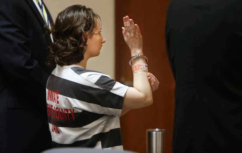 FILE - Gypsy Rose Blanchard raises her right hand and swears an oath while pleading guilty...