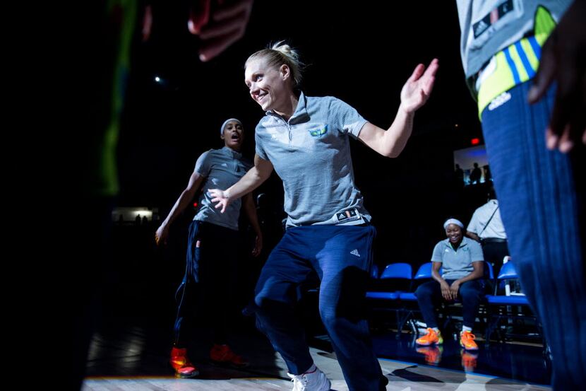 Dallas Wings guard Erin Phillips (31) high five teammates during the pregame ceremony of a...