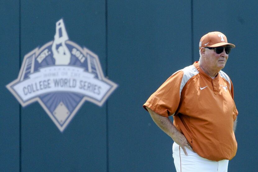 FILE - In this June 17, 2011, file photo, Texas' coach Augie Garrido surveys the playing...