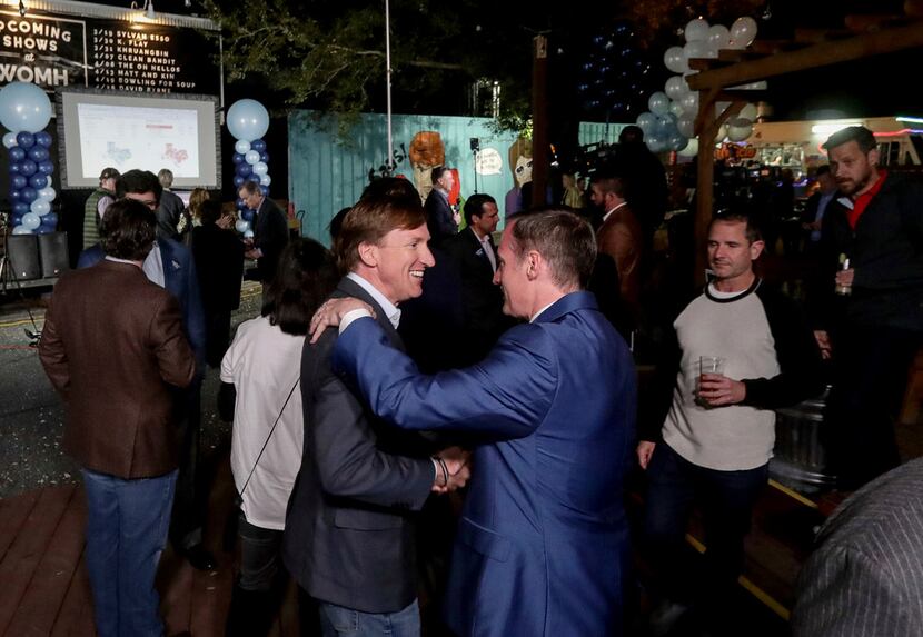 Andrew White (front left) a Democratic candidate for governor, greets Beau Miller during an...