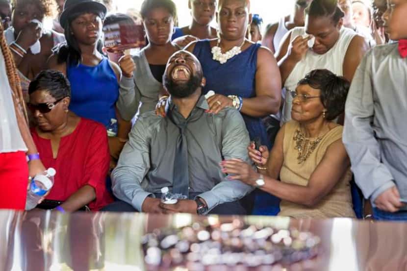 
A distraught Michael Brown Sr. cried out in anguish during his son’s graveside ceremony at...